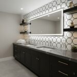 Black and white geometric patterned wall tile with a sleek black vanity and modern mirror.