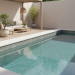 Poolside area with glass mosaic tile backsplash and modern outdoor furniture.