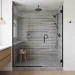 Modern gray glass mosaic tile backsplash in a sleek shower design.