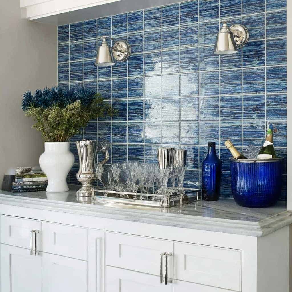 Blue glass tile backsplash, modern kitchen decor, glass mosaic tile, stylish kitchen design, home renovation.