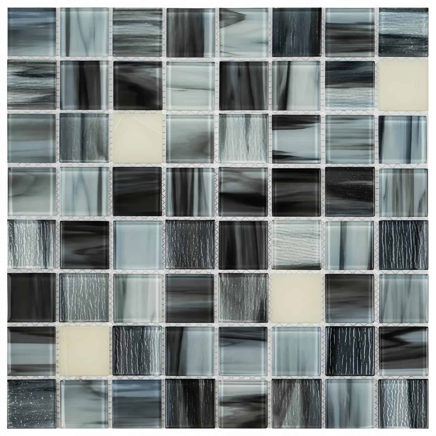 Glass tile backsplash, mosaic tiles, and pool tiles in shades of black, gray, and cream.