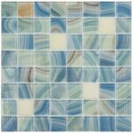 Glass tile mosaic with blue, green, and beige tones, featuring various textures and patterns for backsplash or pool decoratio.