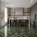 Bright, contemporary kitchen featuring gray cabinetry and a striking green patterned tile floor. Elegant and functional desig.