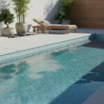 Poolside glass mosaic tile for a modern backyard design, featuring a sleek and reflective surface perfect for pool linings an.