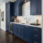 Mother of pearl shell tile backsplash with a white and gold mosaic pattern in a modern kitchen setting.