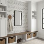 White and gray patterned wall tile with a textured surface, used as an accent wall in a bright, modern entryway.