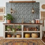 Image of peel and stick tile backsplash behind a rustic kitchen counter.
