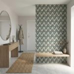 Decorative wall tile with a blue and white leaf pattern, textured surface, suitable for accent walls.