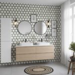 A modern bathroom with peel and stick wall tiles, round mirrors, and a wooden vanity. Perfect for easy DIY backsplash updates.