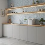 Glass tile backsplash with blue mosaic design in contemporary kitchen setting.
