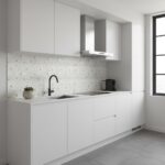 Bright white kitchen with mother of pearl shell tile backsplash and modern fixtures.