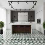 Stylish black and white geometric patterned tile in a contemporary kitchen with white cabinets and black fixtures.