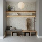 Beautiful shell tile wall with mother of pearl accents in a modern entryway. Features floating shelves, a coat rack, and mini.