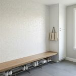 Elegant shell tile wall with mother of pearl finish in a modern entryway.