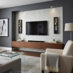 Modern living room with a feature wall of mother of pearl shell tiles behind a mounted flat-screen TV.