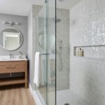 Mother of pearl shell tile in a modern bathroom shower area.