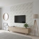 Modern living room with shell tile accent wall, TV, and minimalist decor.