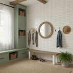 White tile wall with subtle texture, wooden accents, and green storage cabinet. Perfect for a welcoming, stylish home entry.