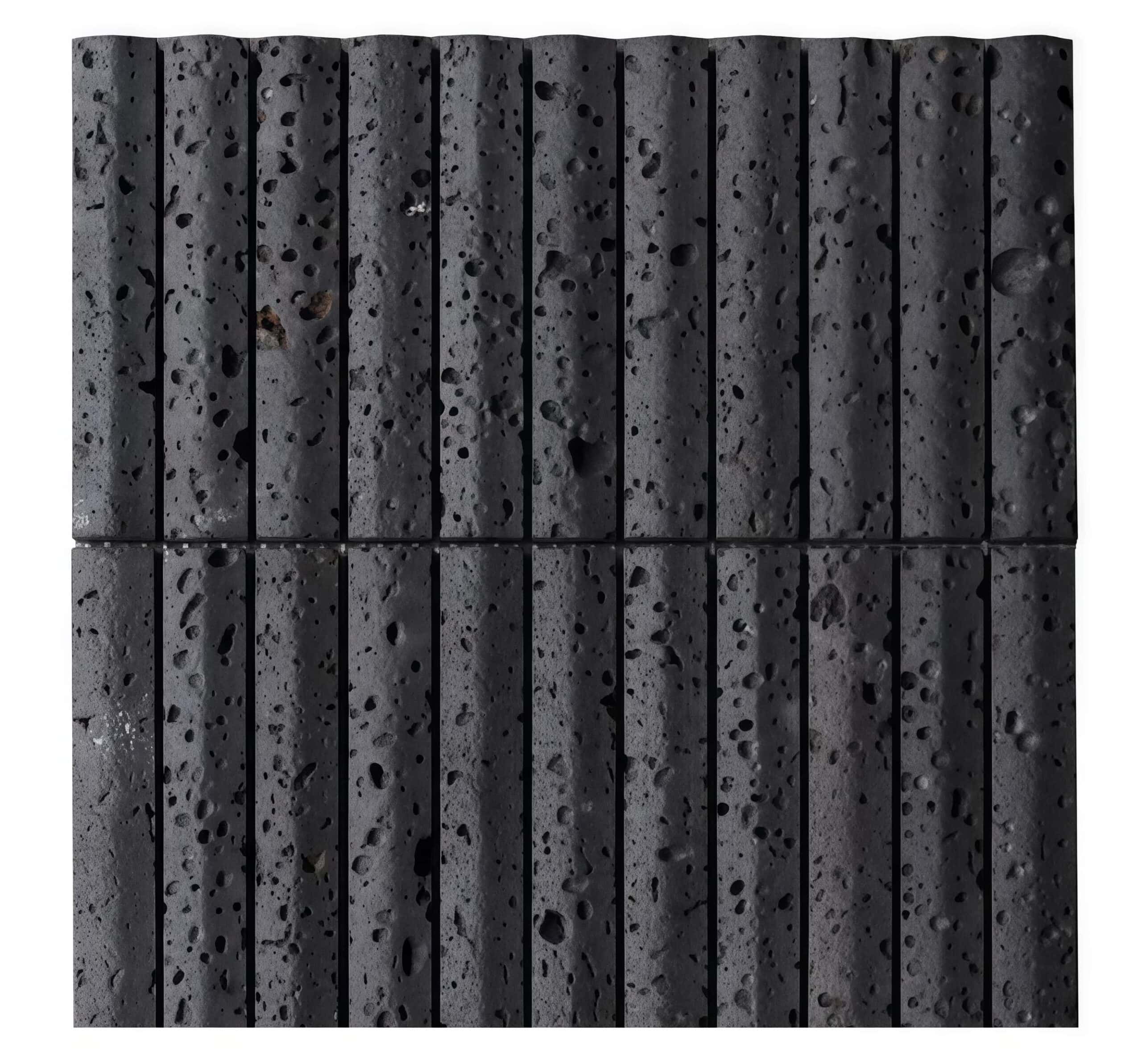 Dark gray concrete tile with a rough, porous texture and vertical grooves.