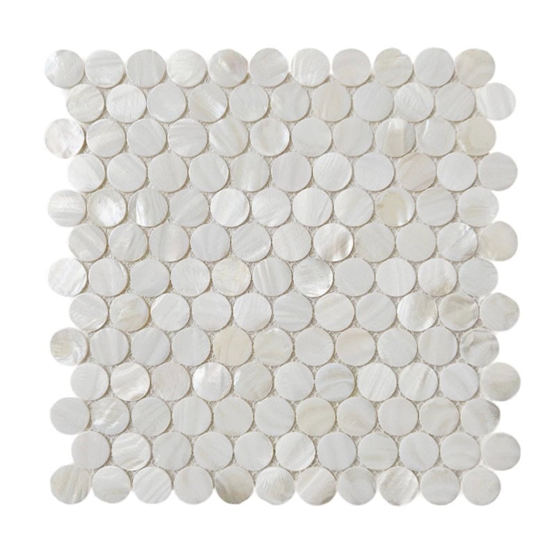 Shell tile made from mother of pearl with a circular pattern.