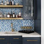 Blue glass tile backsplash with mosaic pattern in contemporary kitchen setting.