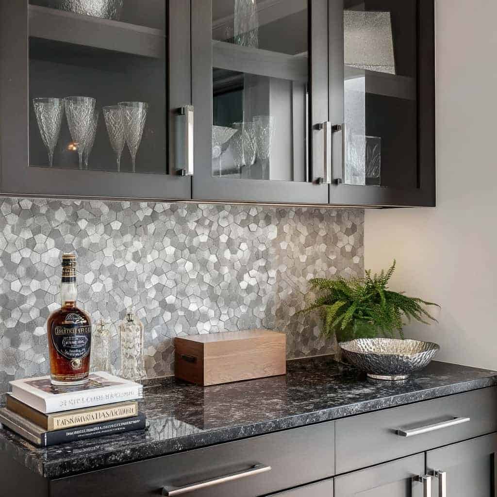 Image of a modern kitchen with peel and stick tile backsplash, gray cabinets, and decorative accessories.