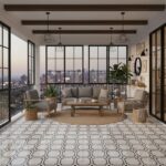 Balcony with patterned white and black tile floor, glass walls, and contemporary furniture.