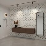 Elegant shell tile wall with mother of pearl accents and a sleek mirror. Perfect for adding a luxurious touch to modern inter.