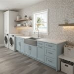 A modern laundry room featuring a beautiful shell tile backsplash with mother of pearl accents, light blue cabinets, and a la.
