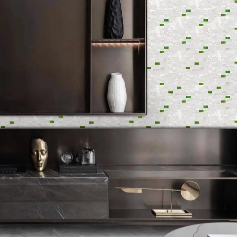 Mother of pearl shell tile wall with green accents in modern interior design.