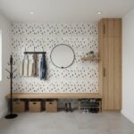 Decorative shell tile wall with mother of pearl and seashell accents in a modern entryway.