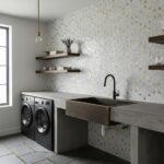 Beautiful kitchen wall featuring mother of pearl shell tile with gold accents. Modern design with a concrete sink and open wo.