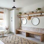 Decorative peel and stick wall tiles in a modern, minimalist entryway.