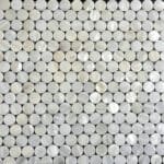 Up of a mosaic made from shiny mother of pearl shell tiles.