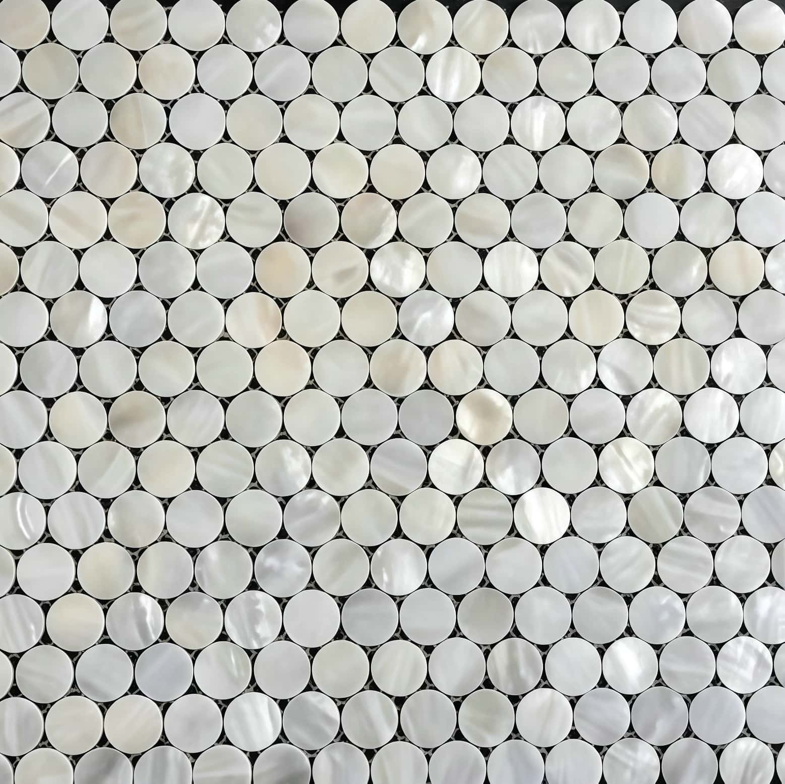 Up of a mosaic made from shiny mother of pearl shell tiles.
