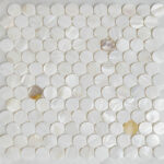 Shell tile made from oyster shells with a lustrous, iridescent finish. Perfect for elegant wall or backsplash accents in home.