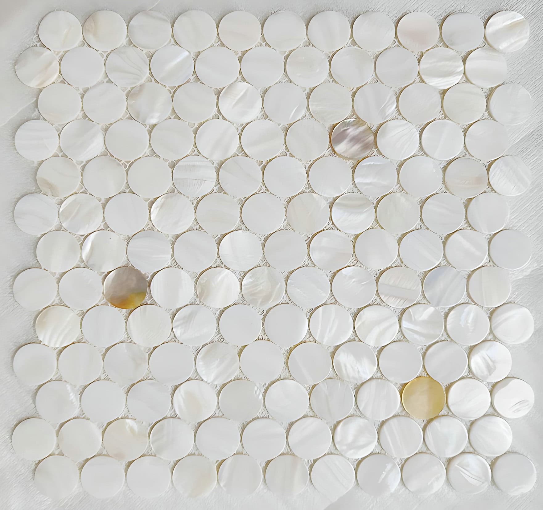Shell tile made from oyster shells with a lustrous, iridescent finish. Perfect for elegant wall or backsplash accents in home.