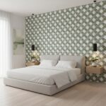 Green and white geometric patterned tile wall behind bed, textured ceramic tiles, contemporary design.