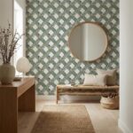 Green and white patterned ceramic tile wall with a round mirror, creating a fresh and stylish entryway or living space accent.