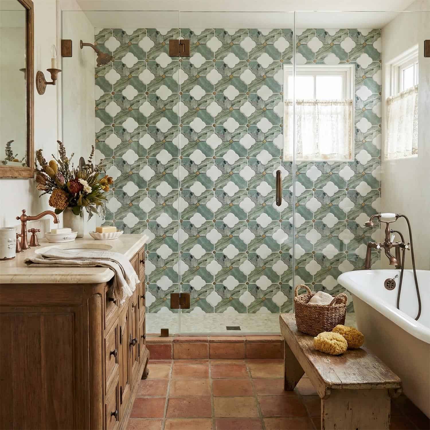 Blue and white patterned ceramic tile in the shower wall, textured with a matte finish.