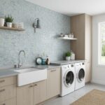 Blue glass tile backsplash behind laundry sink and washer in modern laundry room.