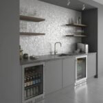 Elegant shell tile backsplash with mother of pearl accents.