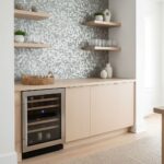 Modern kitchen with peel and stick wall tiles, cabinetry, and open shelves.