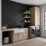Black pebble stone tile, textured surface, used as accent wall in laundry room.