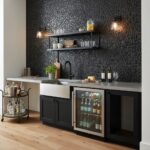 Black textured stone tile backsplash with matte finish behind sink and countertop.