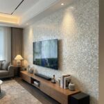 Mother of pearl shell tile wall with iridescent seashells creating a luxurious textured surface. Perfect for elegant home int.