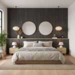 Black textured tile wall behind the bed with round mirrors and wall-mounted lamps.