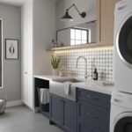 Bright laundry room featuring a white washing machine and dryer, with a sleek countertop and decorative backsplash tiles.