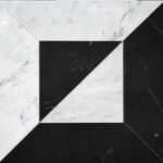 Black and white marble tile with geometric design.