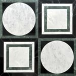 White marble tiles with black and green accents, featuring circular and square designs.